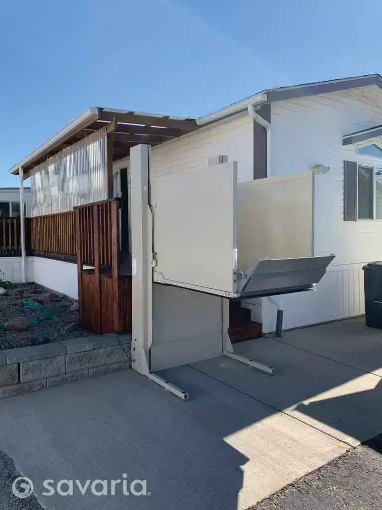 An exterior view of a house with an accessibility Savaria M2Lift Vertical Platform Lift installed.